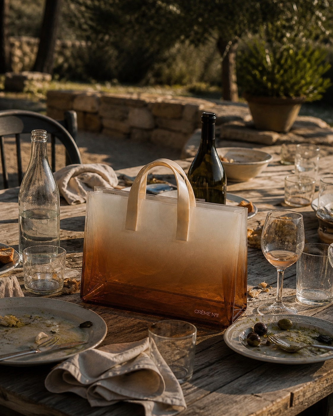 VOILE by CRÈME N°® resting on a long table after lunch in Provence